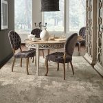 Small dining table on area rug | Flooring 101